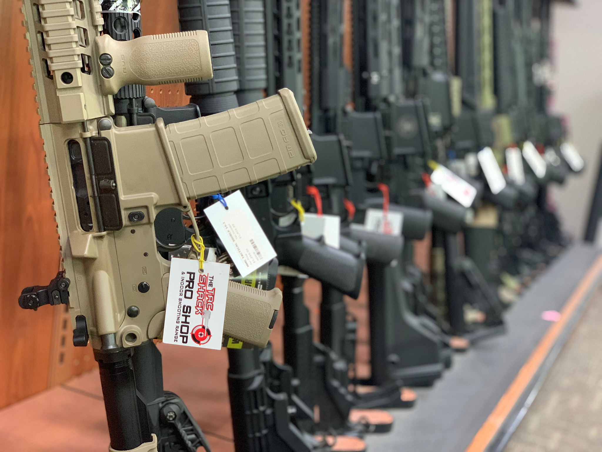Semi automatic rifles lined up in gun store