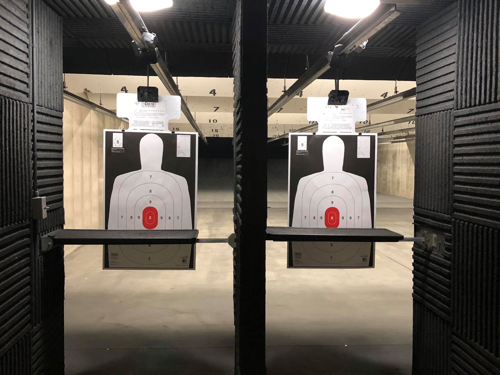 Indoor shooting range lanes with paper targets